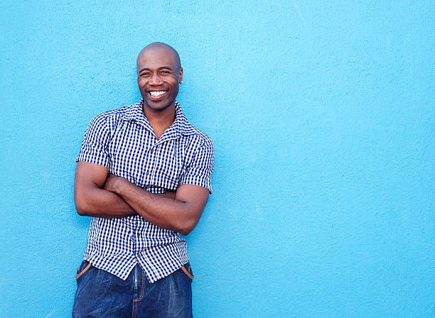 istock Handsome black man smiling with arms crossed 508960572