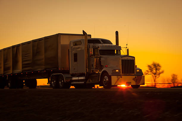 istock Tractor trailer at sunrise on the highway 508963002
