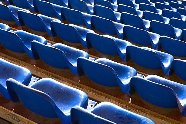 istock empty blue seats at sports stadium 508963311