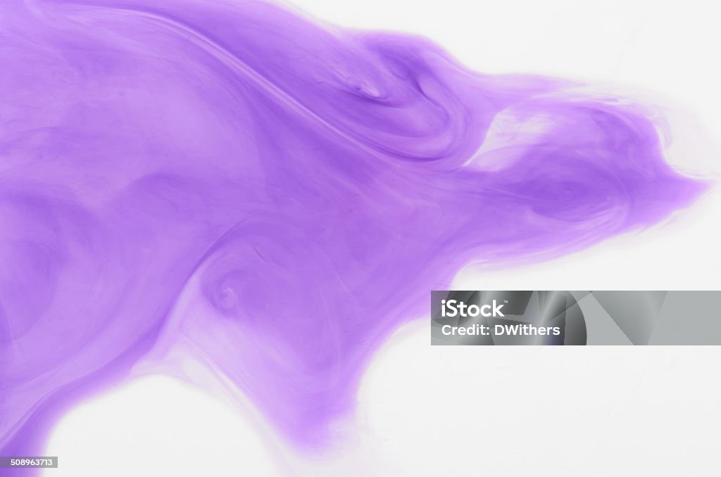 Purple Ink Abstract Background A photograph of purple ink in water.  Natural mixing of colour in water.  Real ink in water, not computer generated. Abstract Stock Photo