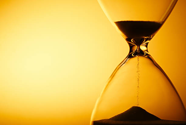 istock Sand passing through the bulbs of an hourglass 508964967