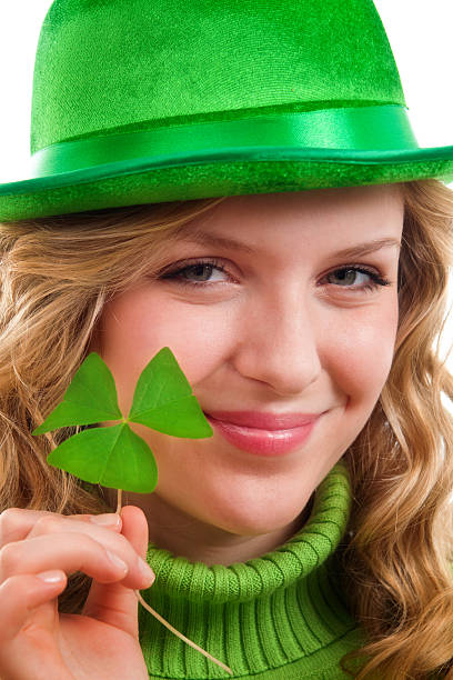 istock St. Patrick’s Day Girl with with Green Clover Leaf on White 508965026