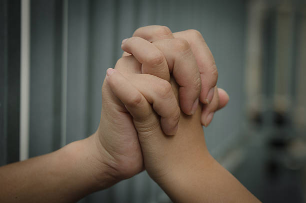 Daughter holding the hands of her mother Daughter holding the hands of her mother child arrest stock pictures, royalty-free photos & images
