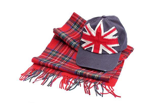 Souvenirs from London. Baseball cap and tartan scarves Souvenirs from London. Baseball cap and tartan scarves  Isolated on white London Memorabilia stock pictures, royalty-free photos & images