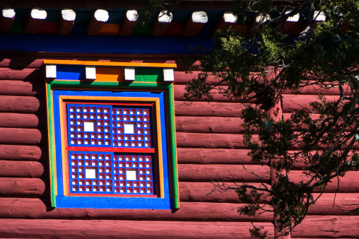 Window and wooden frame, colorful patterns, typical of the Kham region of Tibet.