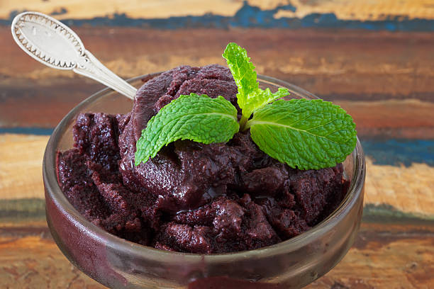Close up of Acai pulp in glass with fresh mint stock photo