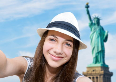 Self-portrait of a young beautiful woman. Statue of Liberty