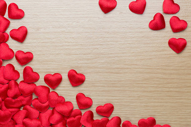 istock Group of red hearts on wood table 509019342