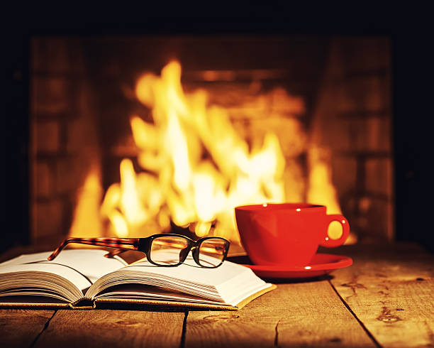 istock Red cup of coffee or tea, glasses and old book 509020906