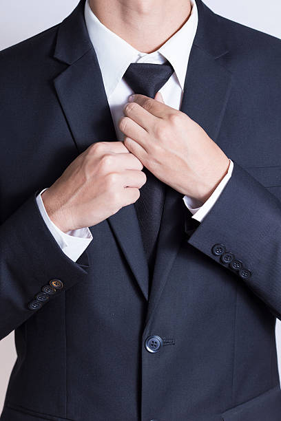 istock Businessman Adjust Necktie his Suit 509022736