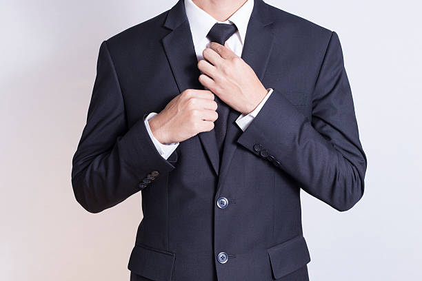 istock Businessman Adjust Necktie his Suit 509023648