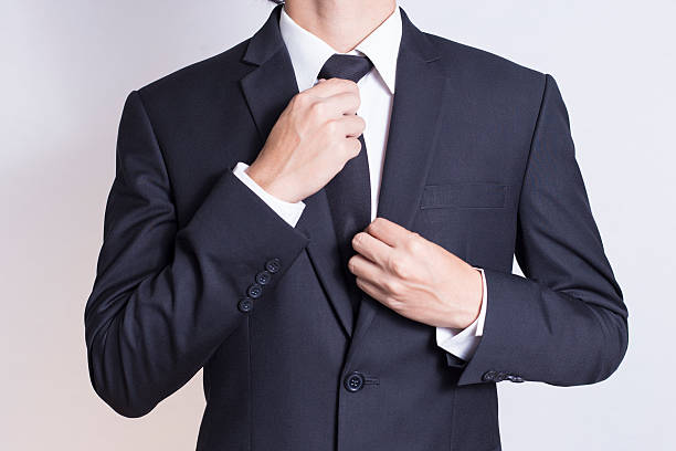 istock Businessman Adjust Necktie his Suit 509023808