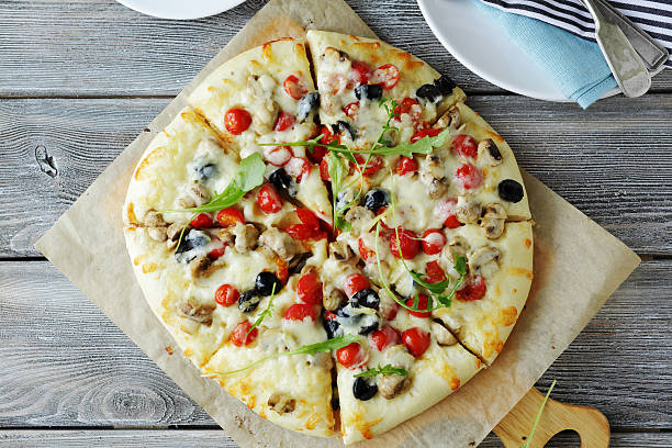 istock hot pizza with mushrooms and olives 509026502