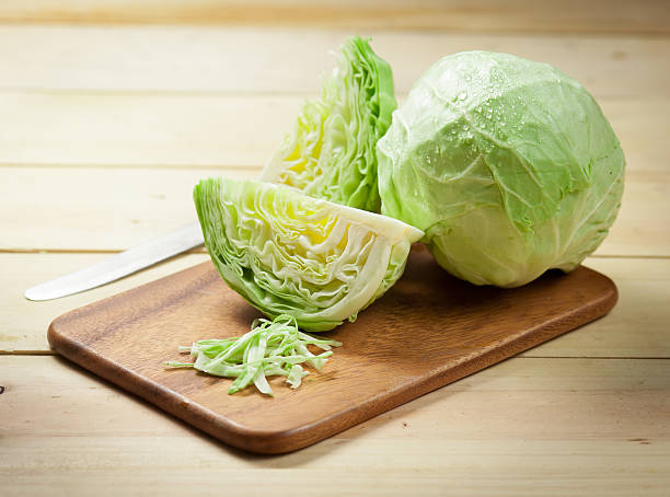 istock cabbage and cutted cabbage on wooden 509027818