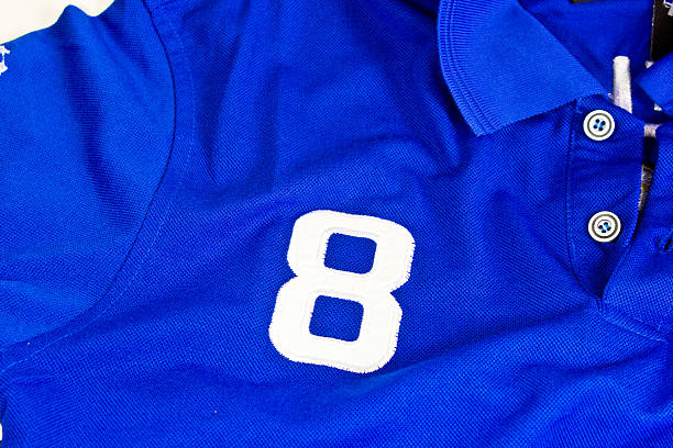 istock Number eight on blue shirt 509027834