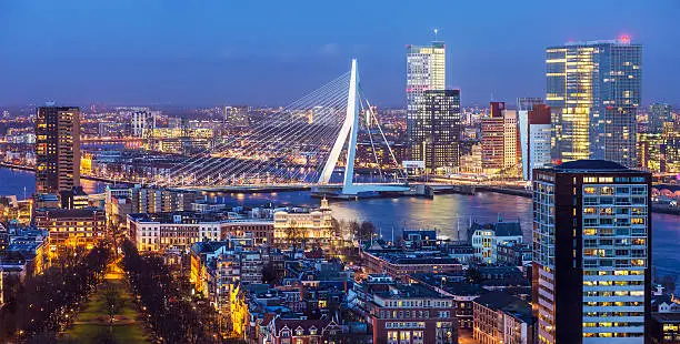 Aerial shot of Rotterdam skyline with Erasmus bridge at twilight as seen from the Euromast tower, The Netherlands