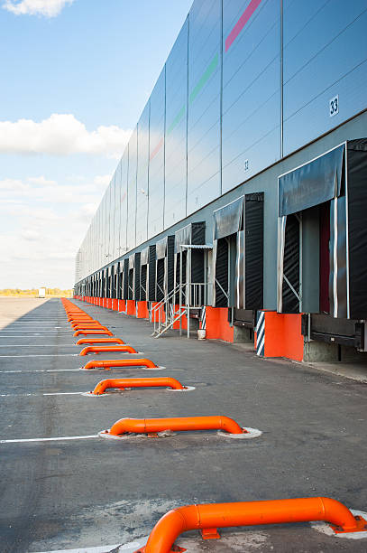 Cargo doors at big industrial warehouse building