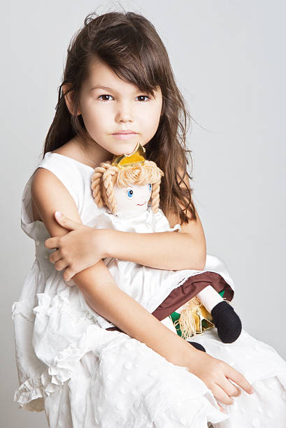 istock Beautiful girl playing with her doll 509030102