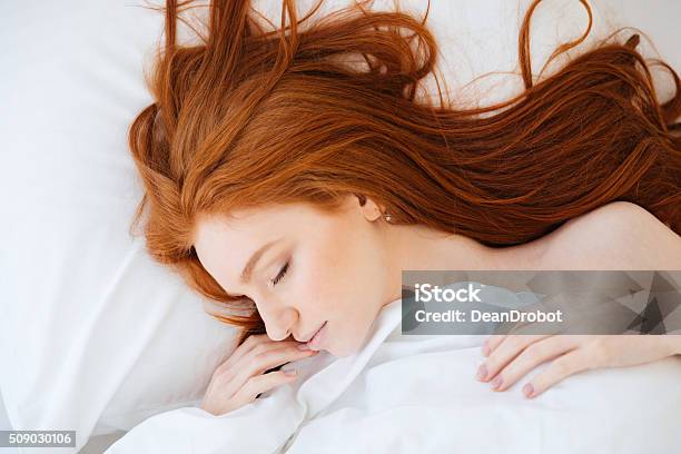 Tender Woman With Red Hair Sleeping In Bed Stock Photo - Download Image Now - Redhead, Sleeping, Women