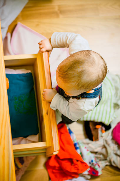 istock Domestic chores - baby throws out clothes 509031600
