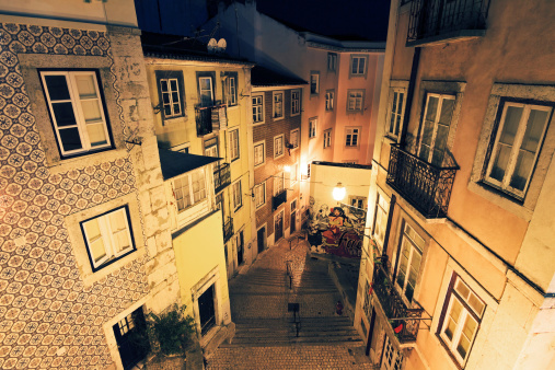 Typical urban scene in the narrow streets of Lisbon, Portugal, at night