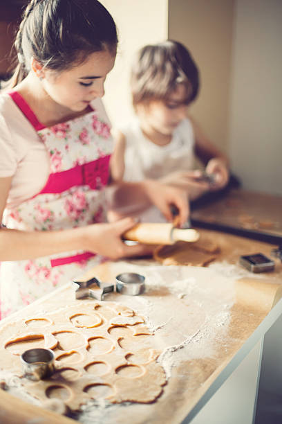 istock Brother and sister making cookies 509036794