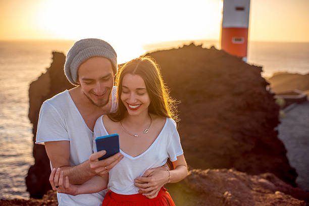 istock Couple enjoying summer vacation near the lighthouse 509037084