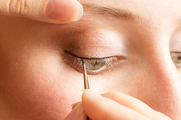 istock Beautician applying eyeliner on the eyelid 509037334