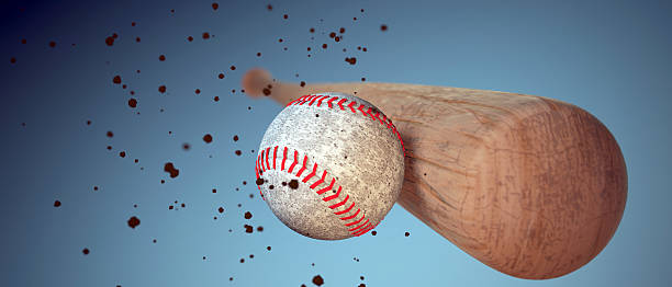 istock wooden baseball bat hitting a ball 509040574