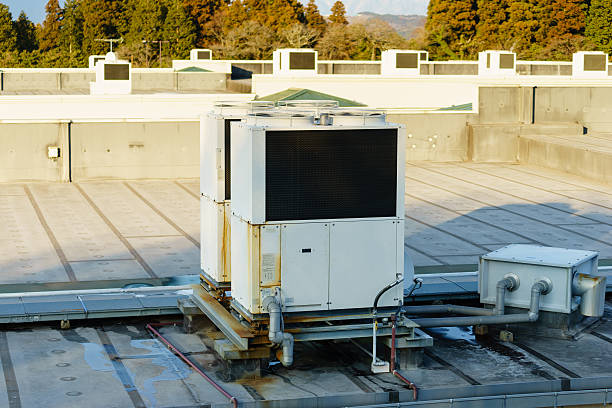 istock row of air conditioning units on a rooftop. 509041162