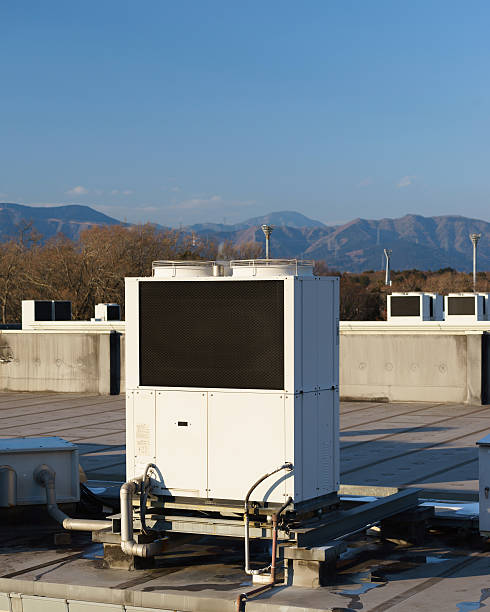 istock row of air conditioning units on a rooftop. 509041262