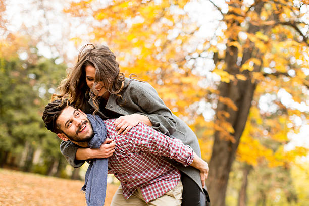 istock Young couple in the autumn forest 509043732
