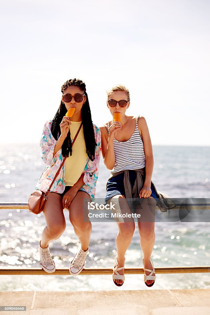Everyone’s got a favorite flavor Shot of two young friends enjoying ice lollies on a summer’s dayhttp://195.154.178.81/DATA/i_collage/pu/shoots/806319.jpg Adult Stock Photo