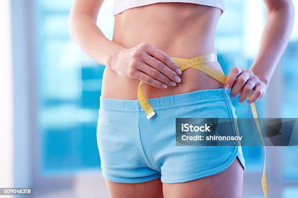 Measuring Waist Stock Photo - Download Image Now - Adhesive Tape, Adult, Cellulite