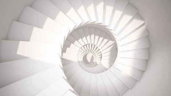 Escalera en espiral blanca en luz solar Resumen interior photo