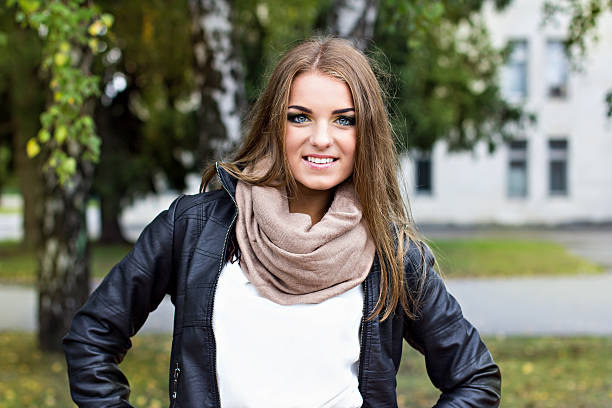 istock beautiful young woman in autumn park 509046823