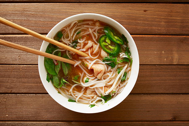 istock eating a bowl of vietnamese beef pho 509046954