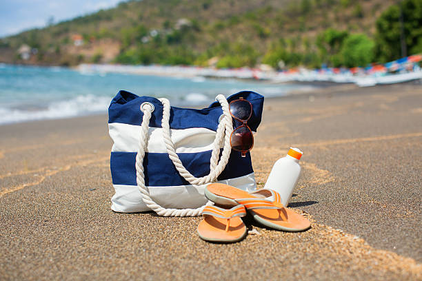 istock Beach bag, flip flops, sunscreen and sunglasses 509047777