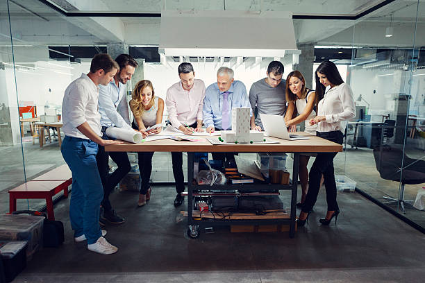 istock Team of architects reviewing architectural model in the office. 509047819