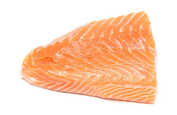 istock Closeup of salmon steak on white background 509048251
