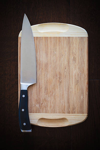 istock 8 inch chef's knife on a cutting board 509049222