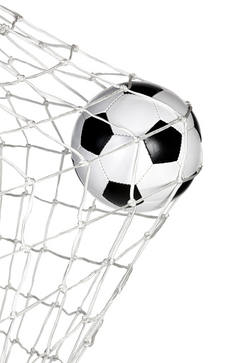 Soccer ball in the goal net isolated on white background