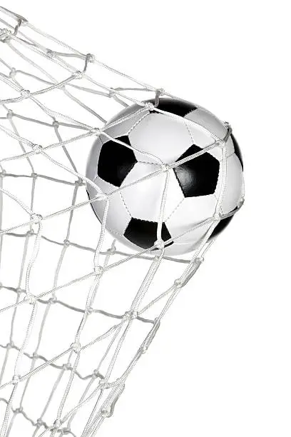 Soccer ball in the goal net isolated on white background