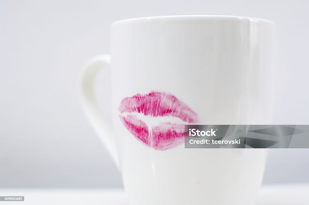 Ceramic coffee cup with rose lipstick Ceramic coffee cup with rose lipstick. Adult Stock Photo
