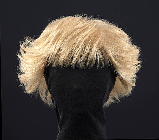 istock female blonde wig on a black background 509051761