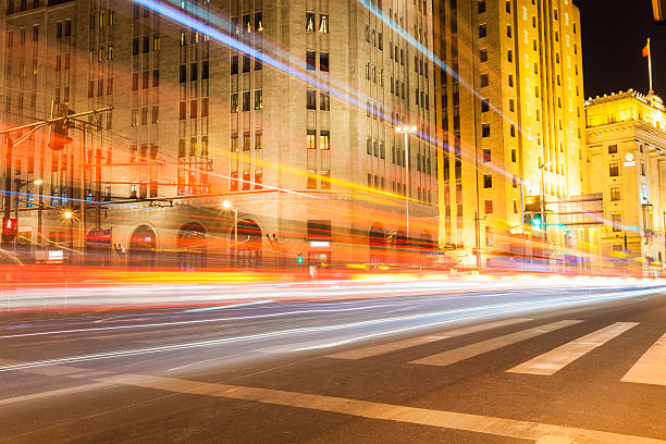 istock shanghai bund at night , historical buildings with light trails 509052383