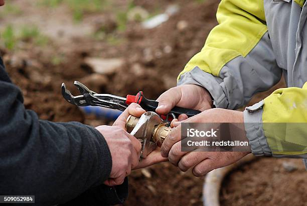 Instalation Of A Water Supply Stock Photo - Download Image Now - Plumber, Teamwork, Installing