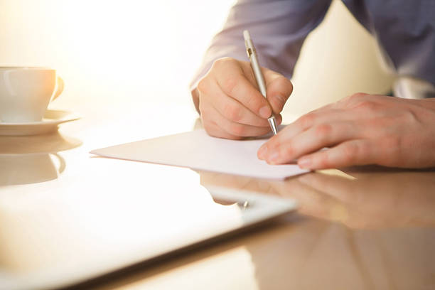istock The male hands with a pen 509053534