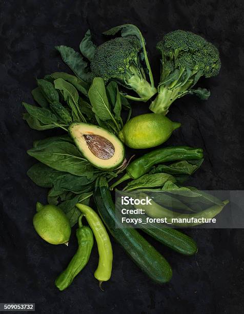 Raw Green Vegetables Set Broccoli Avocado Pepper Spinach Zuccini Lime Stock Photo - Download Image Now