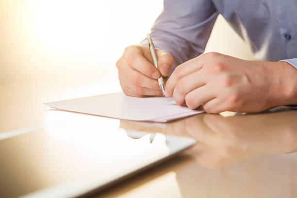 istock The male hands with a pen and the cup 509053894